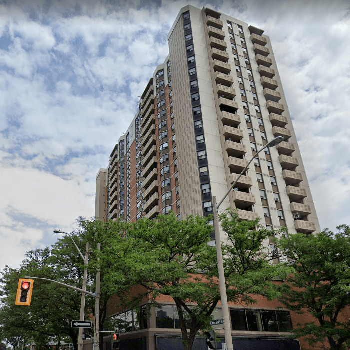 A beige high-rise apartment complex in Hamilton