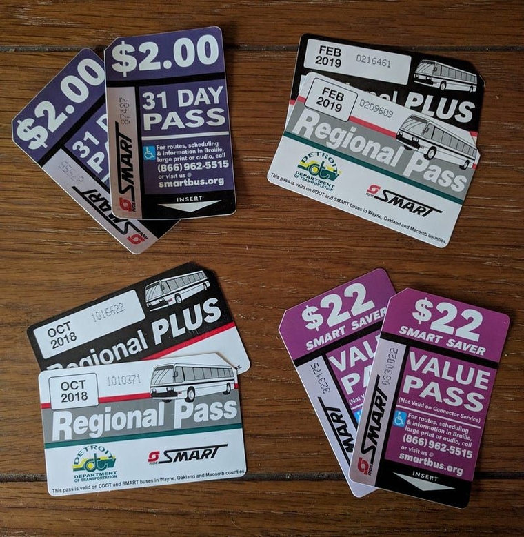 A collection of physical SMART passes including the 31 day pass, the Regional and Regional Plus passes, and the $22 Value Pass.