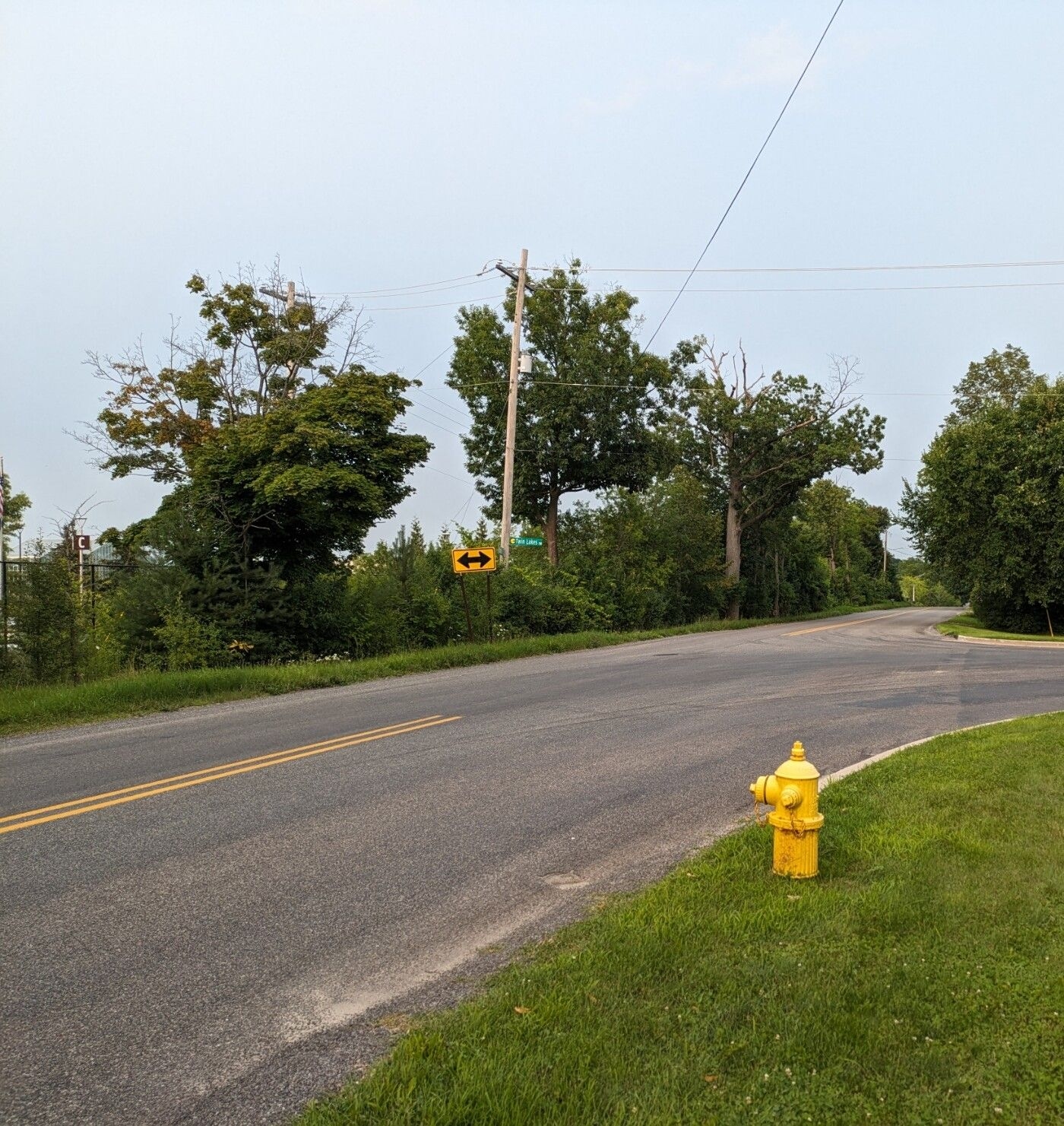 Road with no sidewalk on a hill