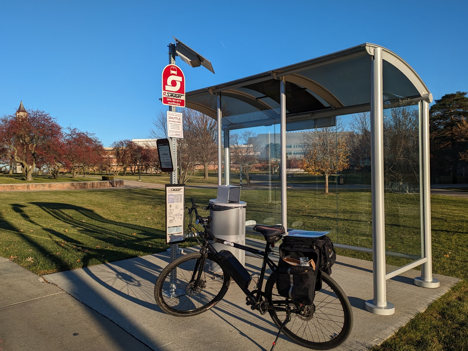 My e-Sparrow, with the trunk bag attached, next to the bus shelter at Oakland University