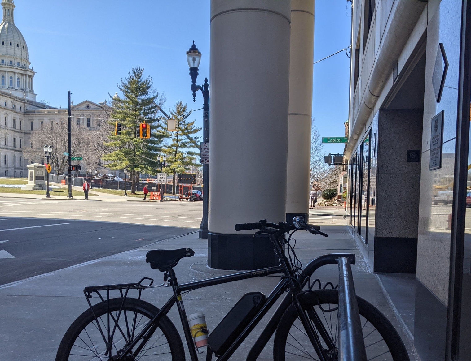 My bike with a House Biggby coffee cup in the cupholder outside the House Office Building