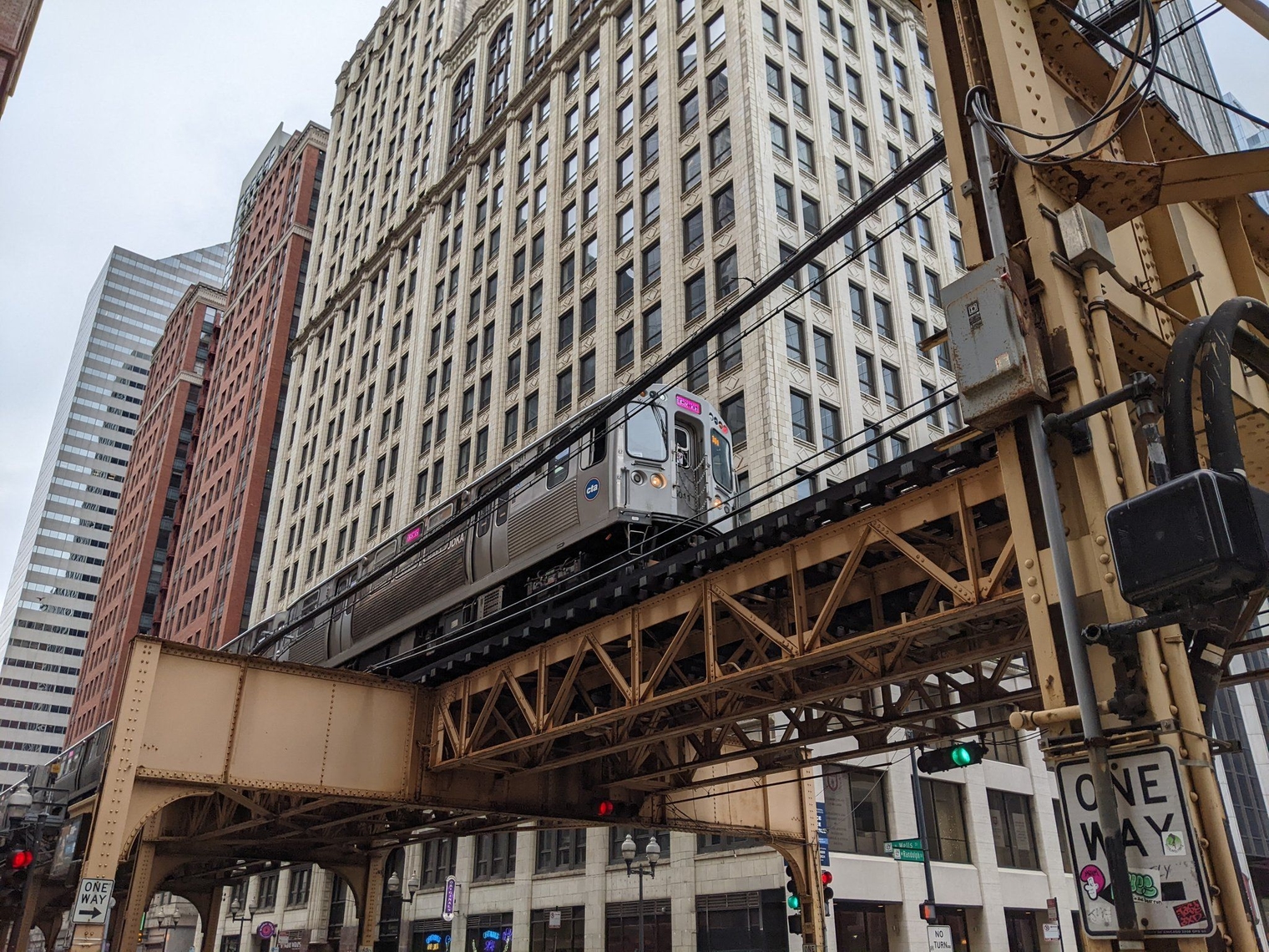 A Pink Line train crossing the river outside the Thompson Center