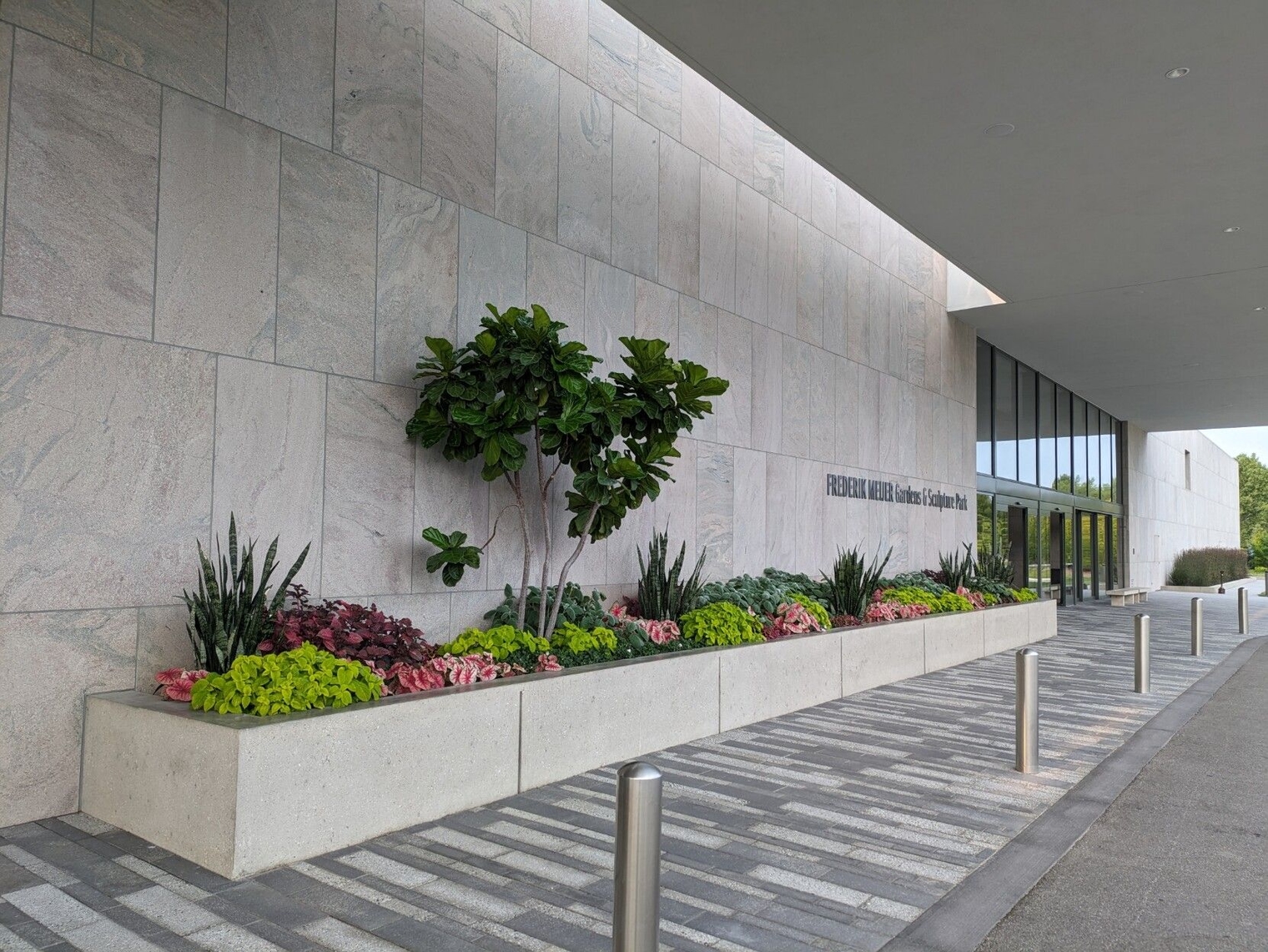 Main entrance to the gardens with a flower display