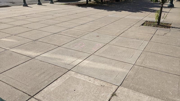 A tiled cement walkway where the shelter used to be