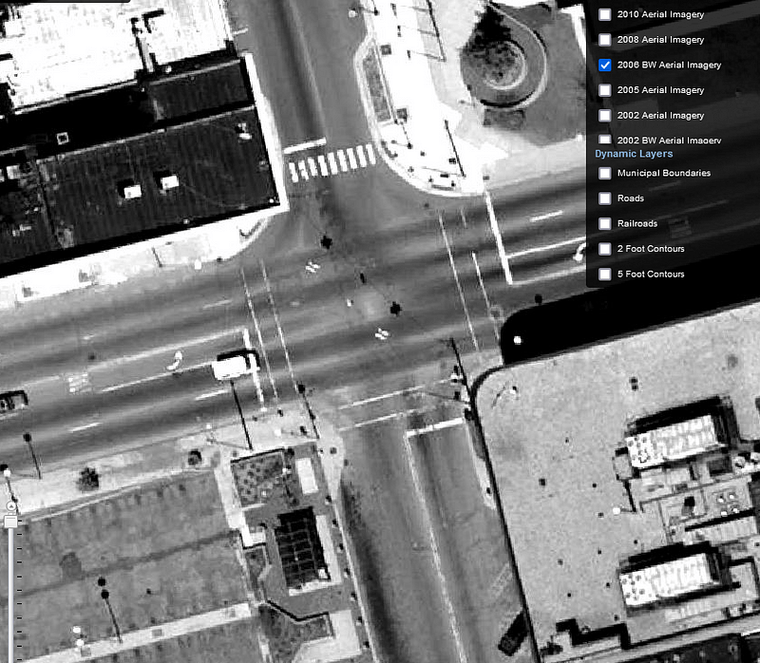 A black and white satellite image of Huron and Saginaw with a bus shelter at the southwest corner of the intersection.