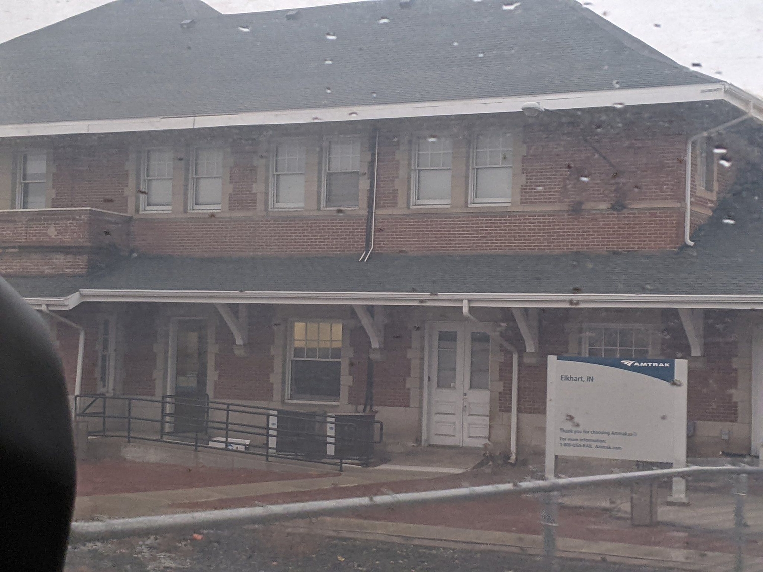 Elkhart Station, a two-level brick building with a retrofitted ramp between the platform and the doorway