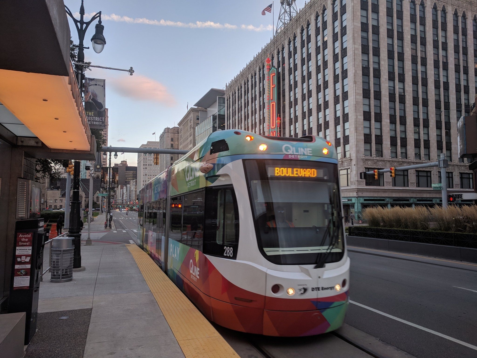 The QLINE in its 2019 multi-colored "Shop, Eat, Play" wrap, arriving at Montcalm Street headed north"