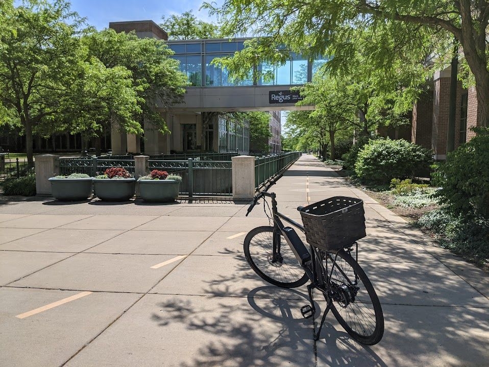 My e-bike on a sidewalk along the pedestrian mall marked for two-way cycling traffic