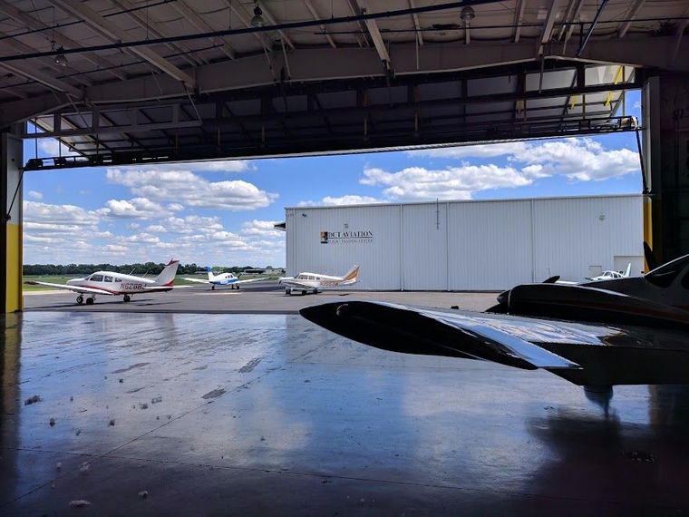 Propeller planes in a hangar at Oakland County International Airport