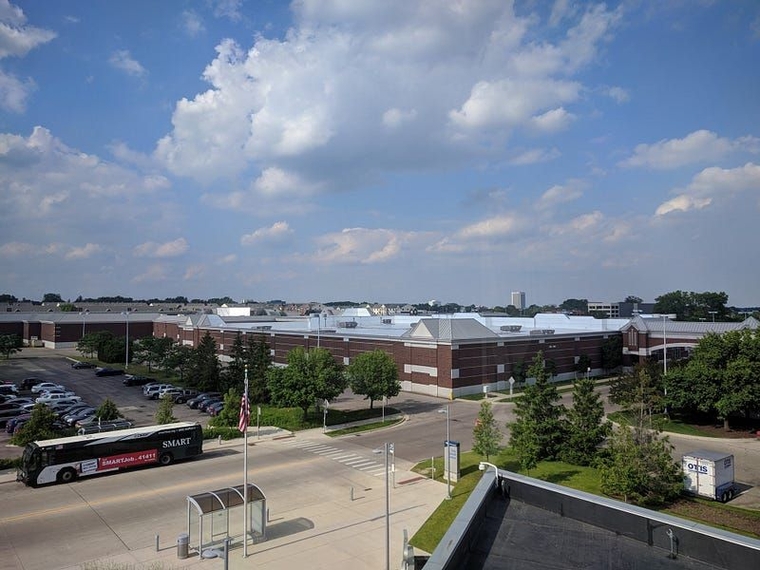 A SMART bus at the inbound Troy Transit Center bus stop as seen from the pedestrian bridge.