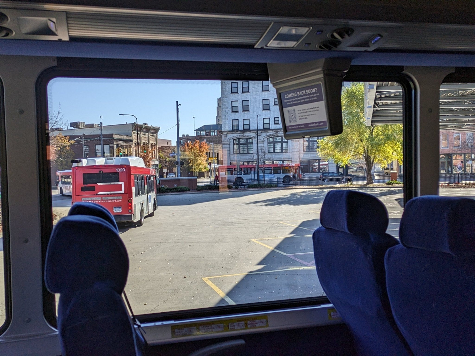 Interior of the coach, with KMetro buses seen departing from the window