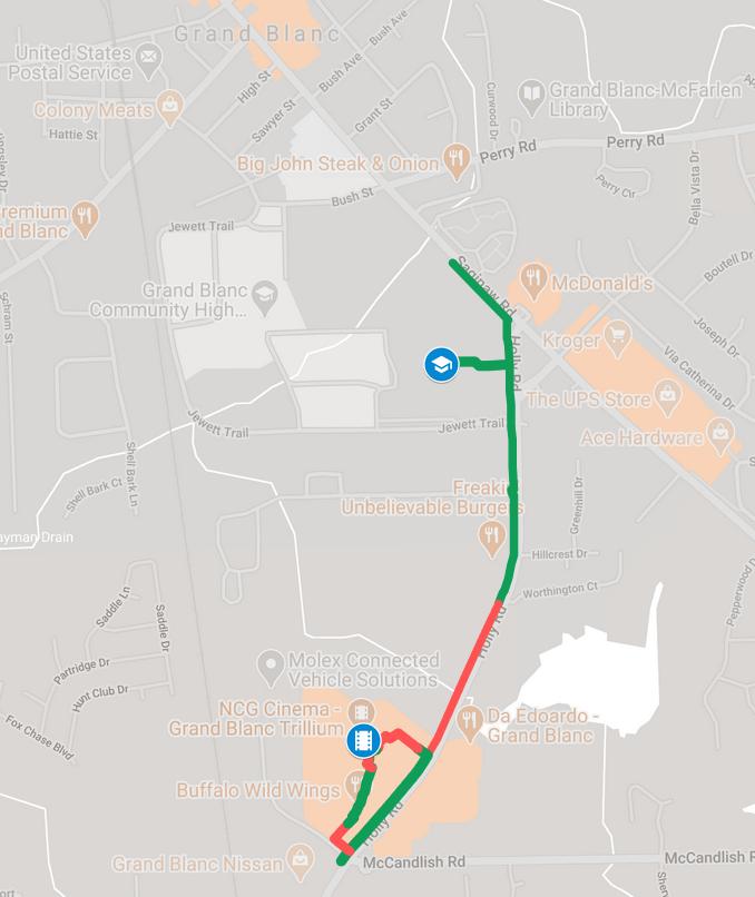 A Google Maps screenshot of the roads surrounding NCG Trillium Cinemas in Grand Blanc. Gaps in the sidewalk along Holly Road are highlighted.