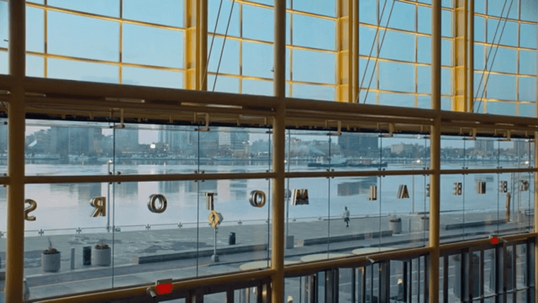 Dodge running down the Riverwalk as seen from inside the RenCen Wintergarden