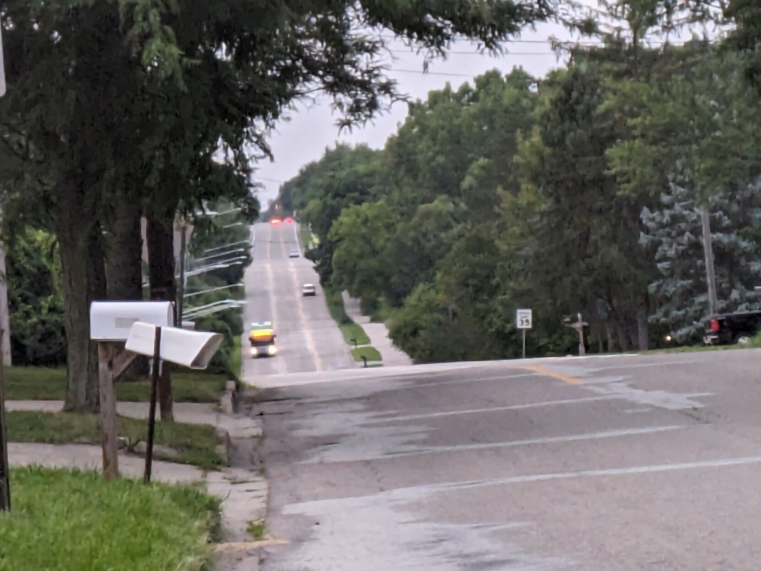 Bus in the distance climbing a steep hill towards me