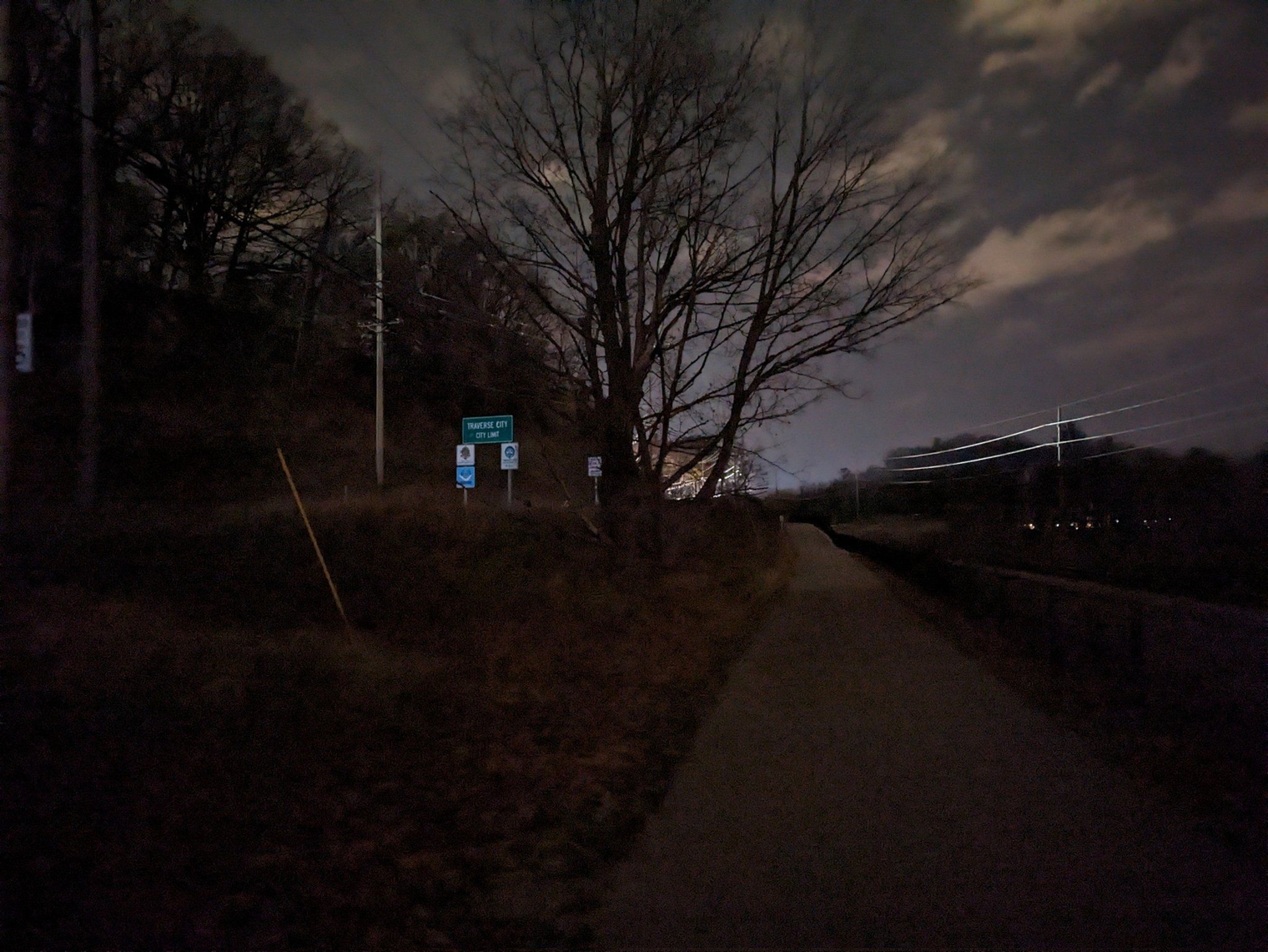 Passing the Traverse City City Limit sign while walking parallel to the tracks