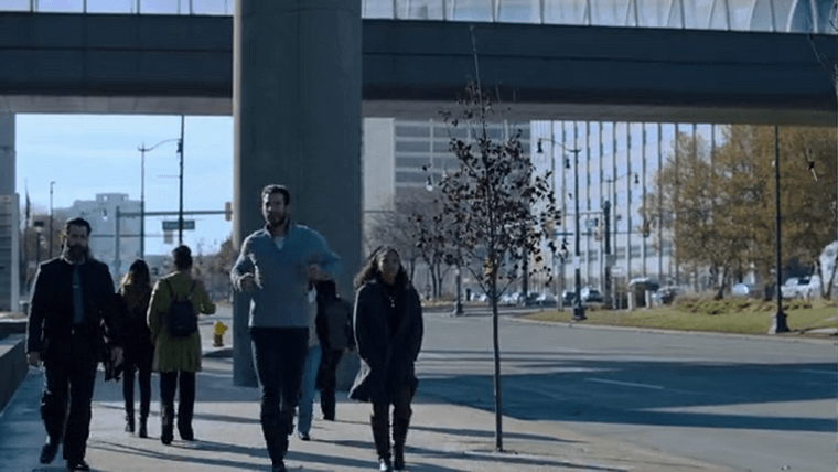 Dodge jogging along Jefferson underneath the RenCen skywalk