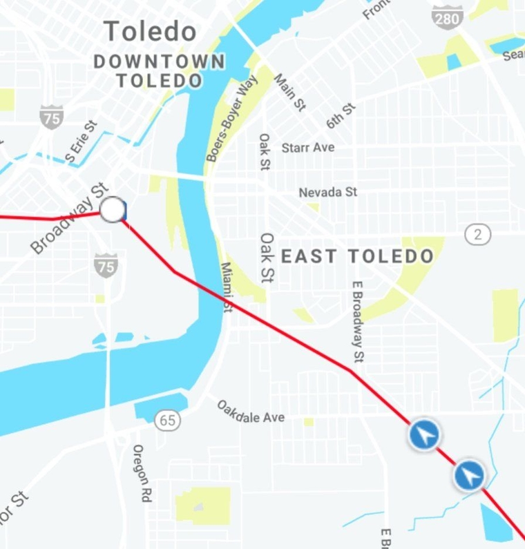 Both trains waiting at the same spot for freight traffic