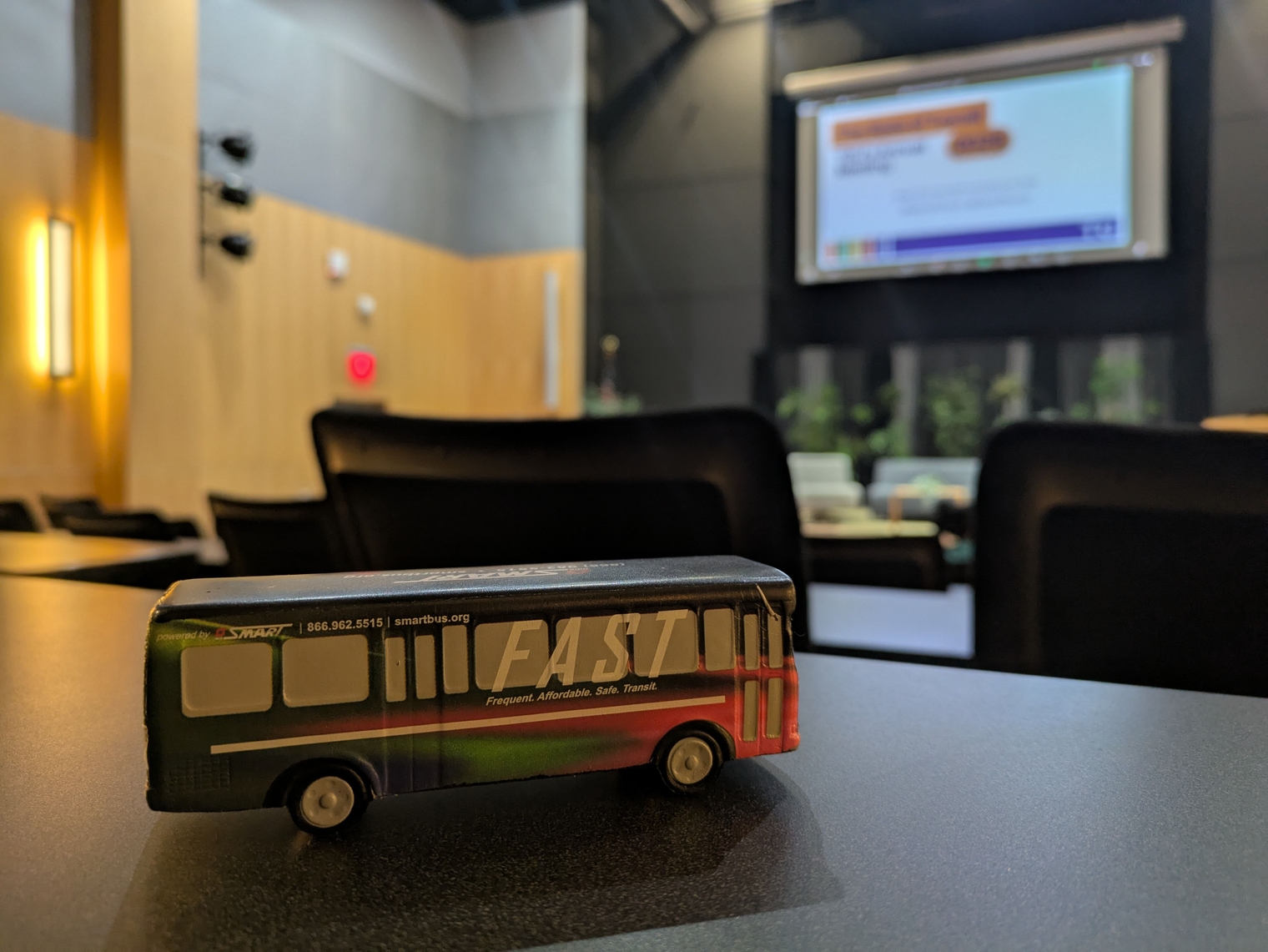 My squishy tie-die FAST bus on a table in the auditorium