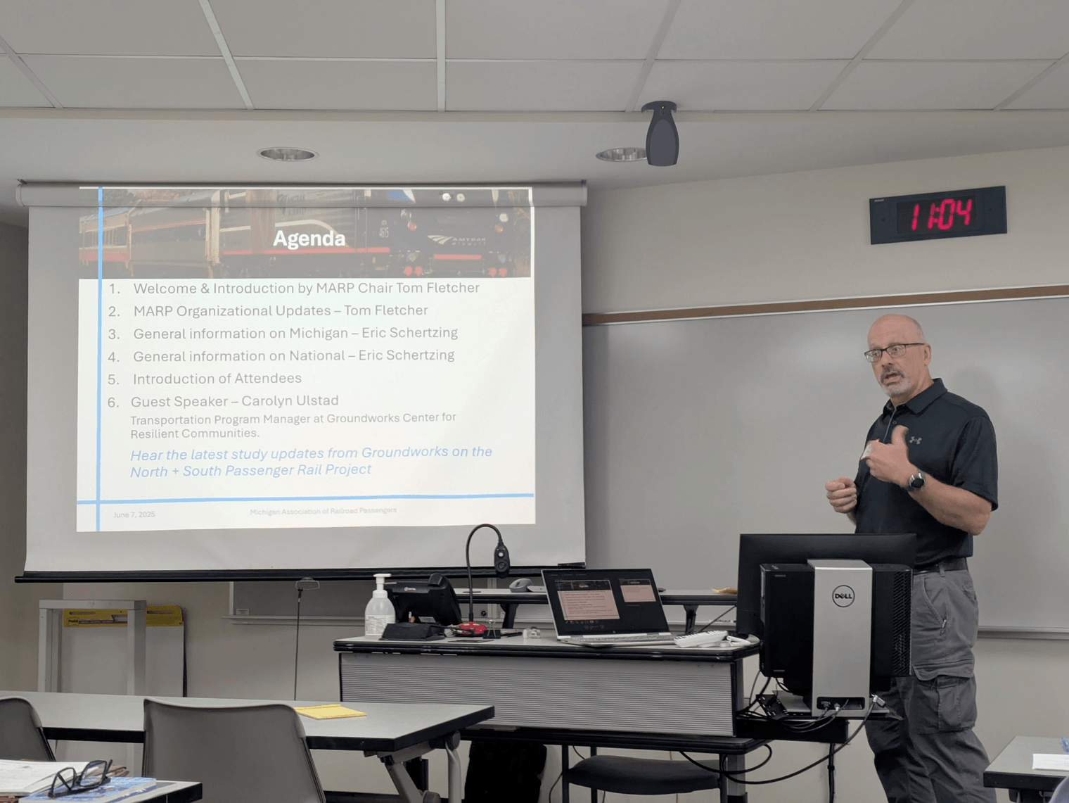 Tom Fletcher presents a slide introducing Eric Schertzing and Carolyn Ulstad