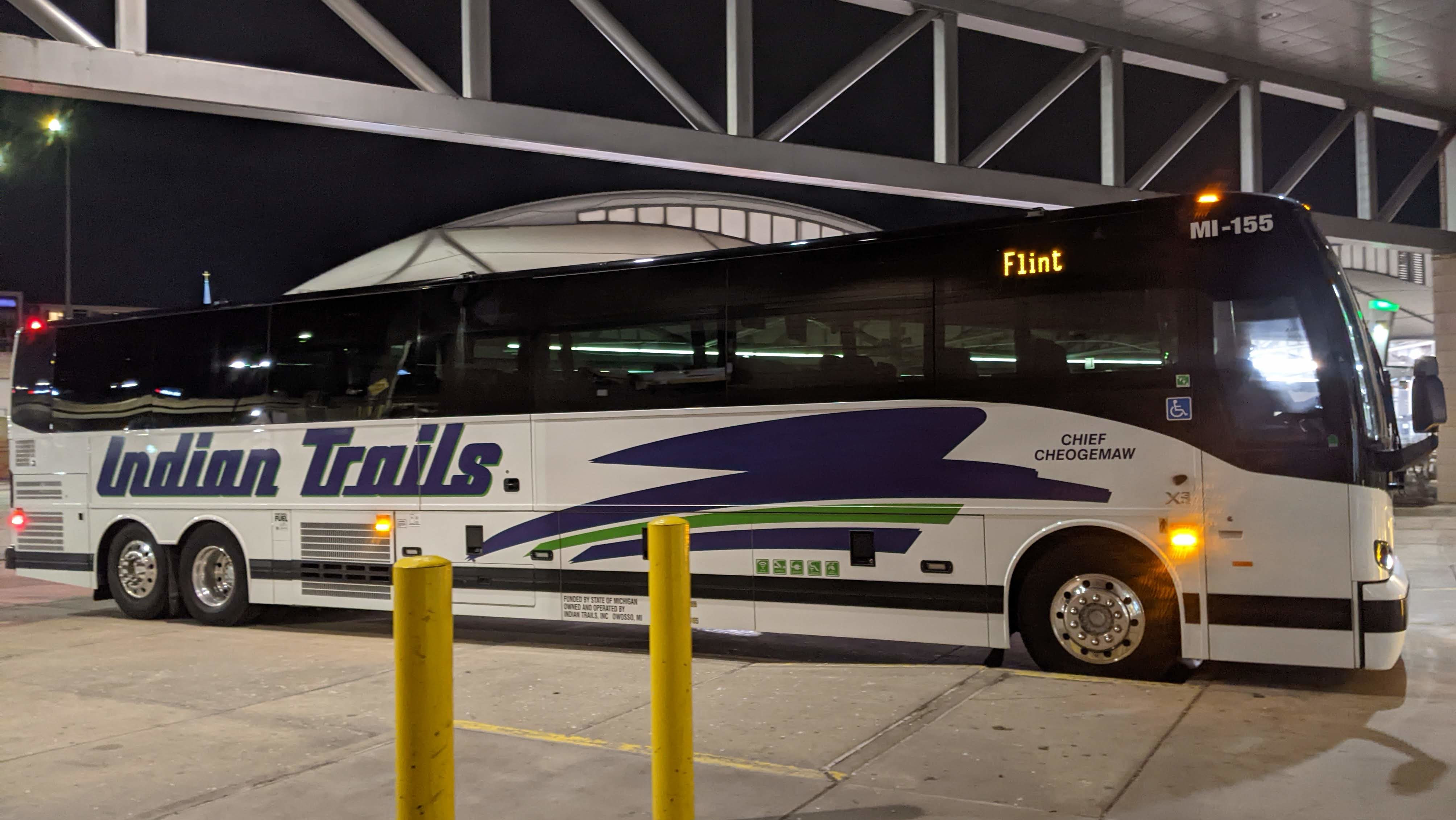 A Flint-bound Indian Trails motorcoach at Rapid Central Station in Grand Rapids at night.