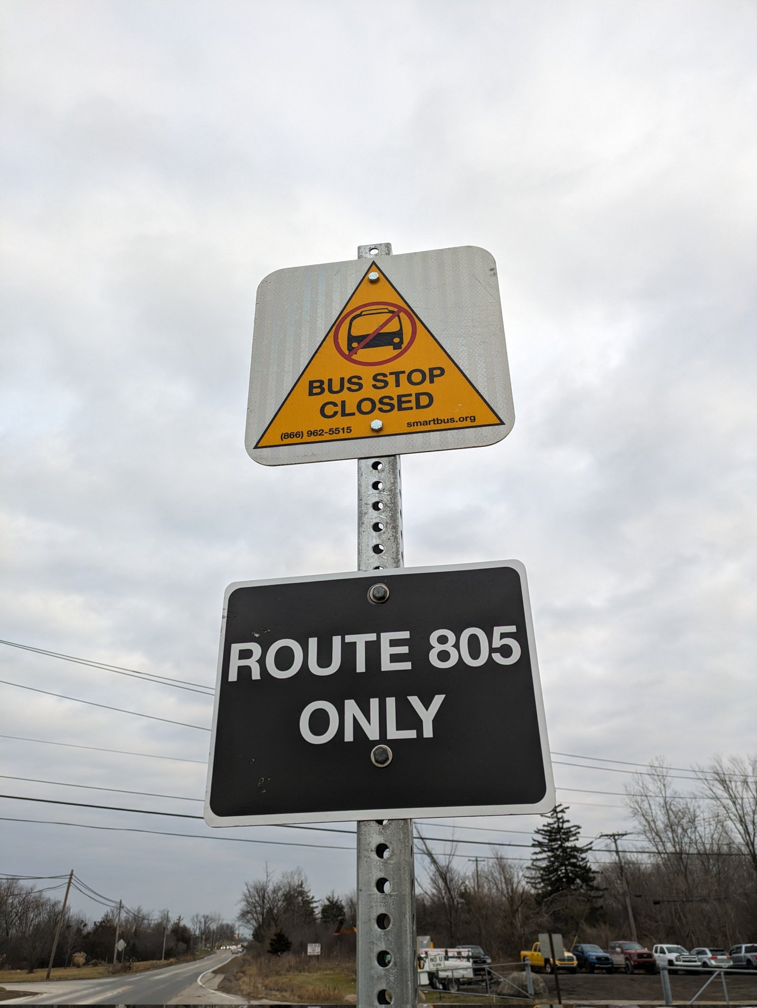 Close up of a sign bolted to the stop pole indicating its permanent closure
