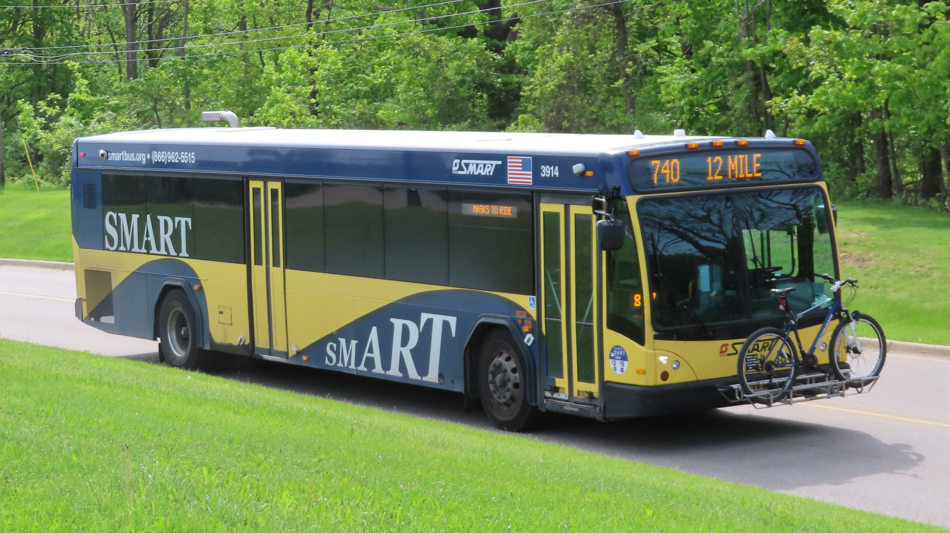 SMART bus 3914, a 2019 Gillig BRT, seen at Oakland Community College's Orchard Ridge campus in Farmington Hills, Michigan.