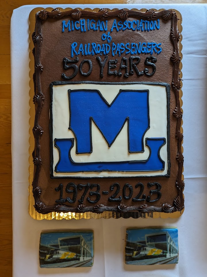 A cake with the MARP logo printed on it. Frosting reads "Michigan Association of Railroad Passengers, 50 Years: 1973 to 2023"