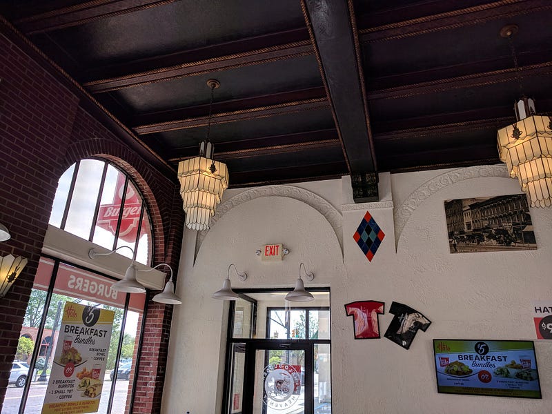 Interior of the building, with original woodwork and chandeliers