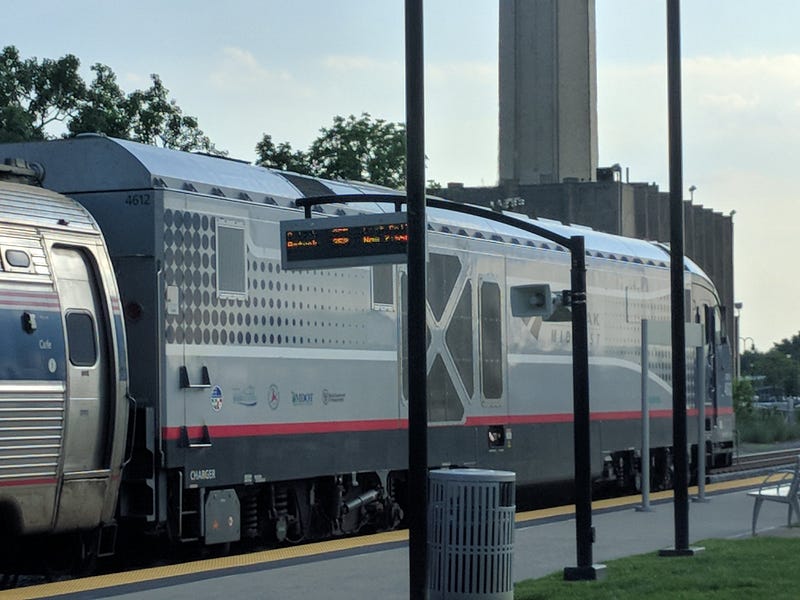 An Amtrak locomotive on a station platform.