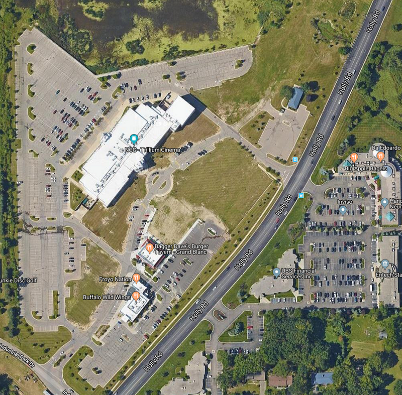 Aerial view of the movie theater and surrounding empty lots
