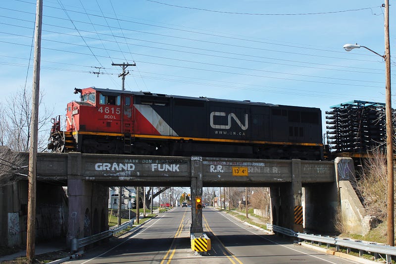 A CN locomotive passing over the bridge